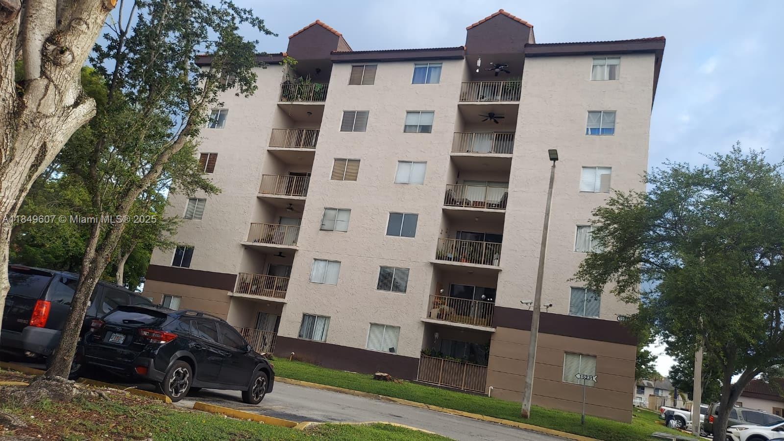 15231 Southwest 80th Street, Unit 209 Miami, FL 33193 - Photo 20 of 21 front view of a building