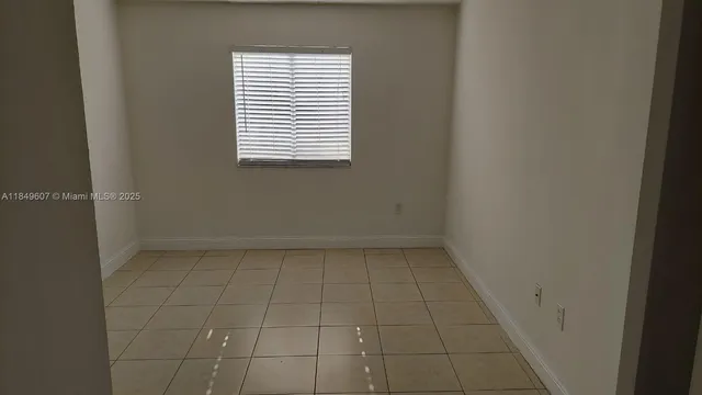 a view of a room that has a window in it
