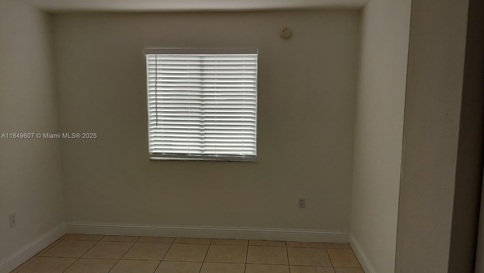 15231 Southwest 80th Street, Unit 209 Miami, FL 33193 - Photo 7 of 21 a view of a small space with a window
