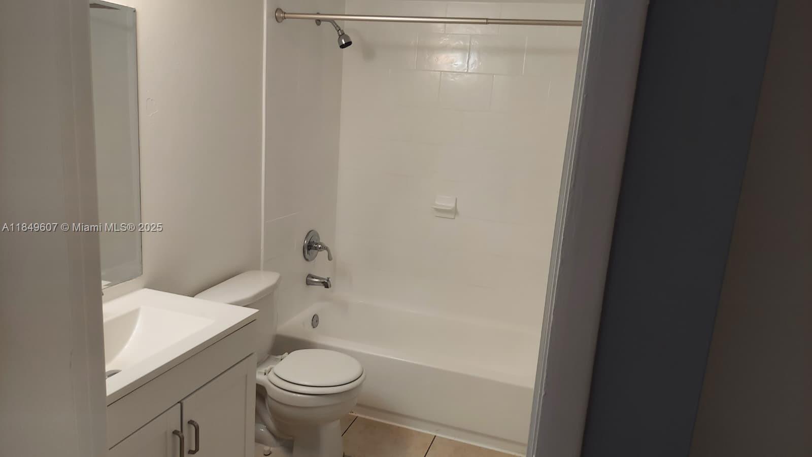 15231 Southwest 80th Street, Unit 209 Miami, FL 33193 - Photo 9 of 21 a white toilet sitting next to a bath tub