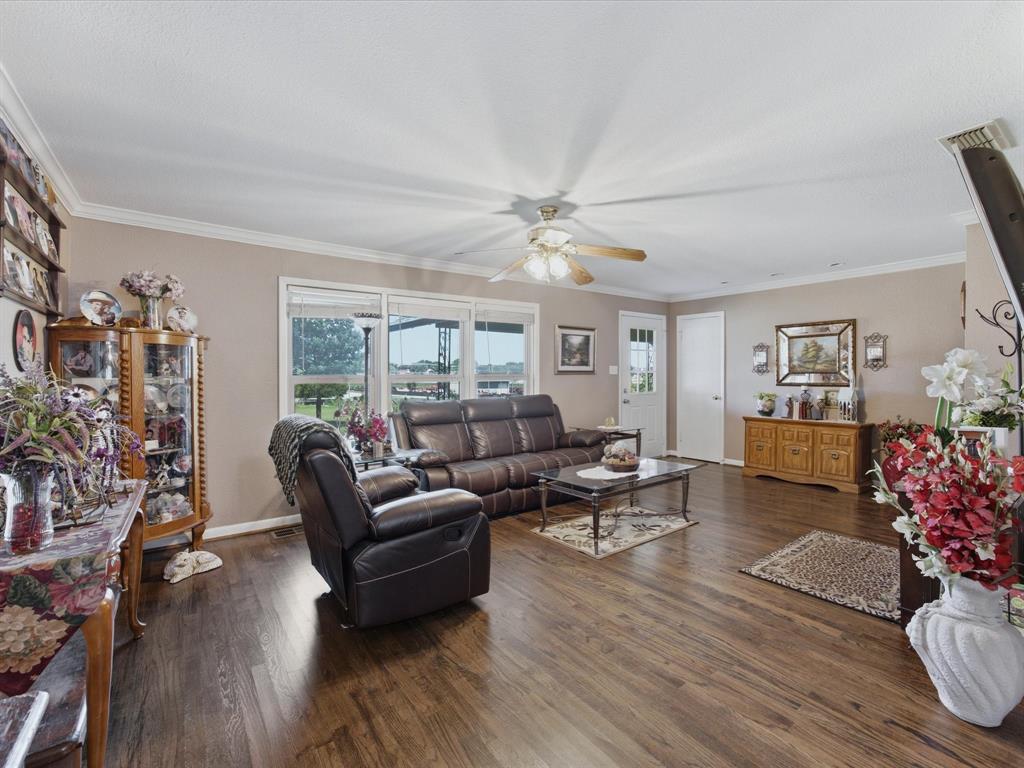 301 Ovilla Road Waxahachie, TX 75167 - Photo 11 of 38 a living room with furniture or wooden floor and a large window