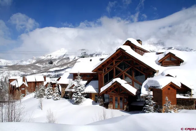 a view of house with yard and seating space