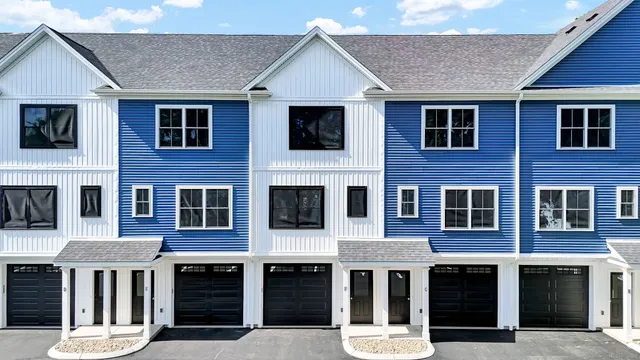 a front view of a house with a large windows