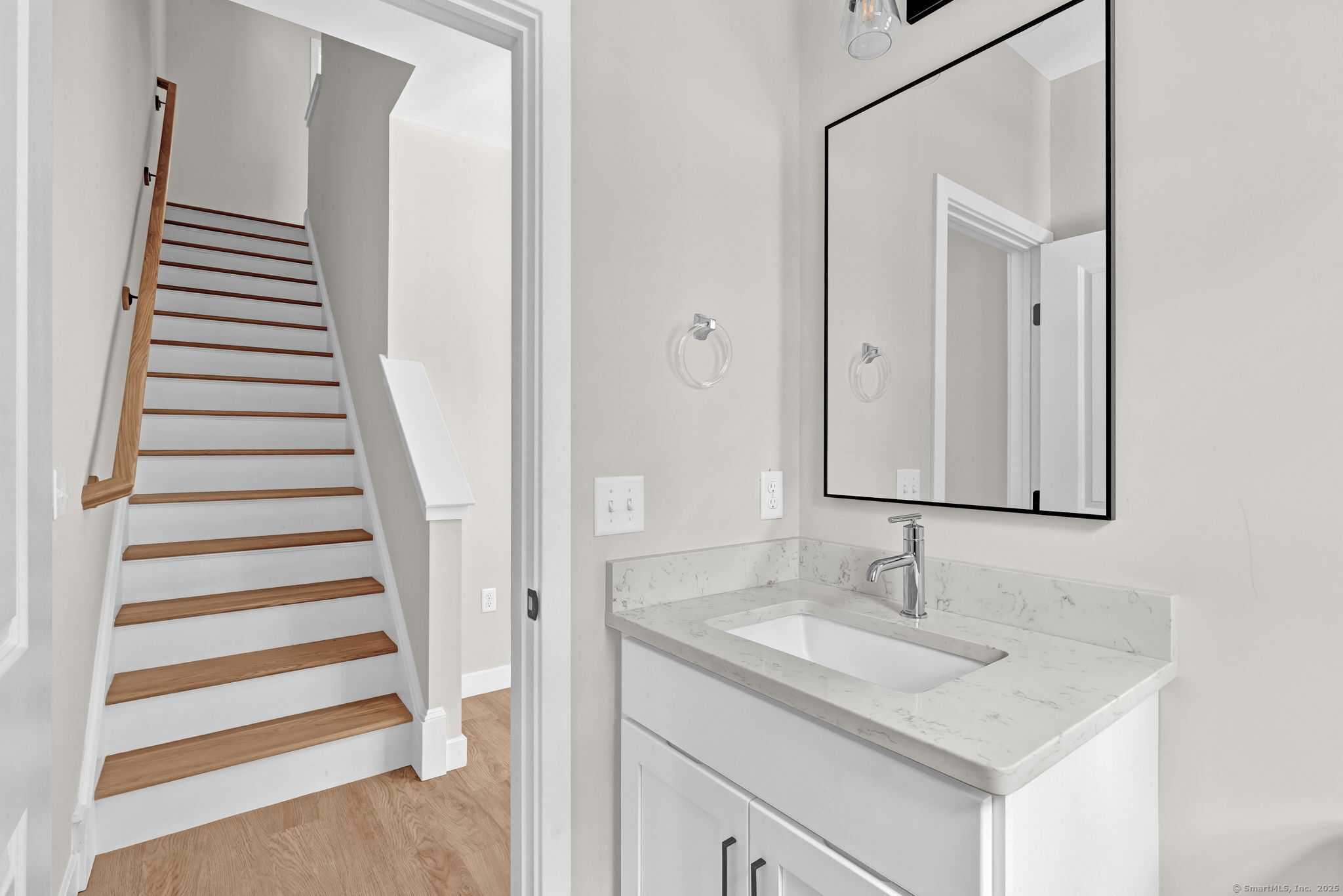 70 Whiting Street, Unit D Plainville, CT 06062 - Photo 14 of 26 a bathroom with a sink and a mirror