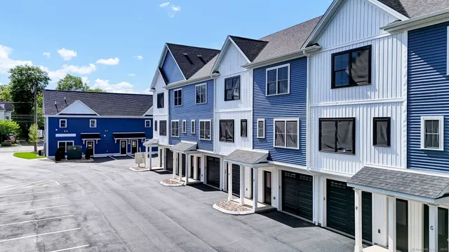 a view of a building with sitting area