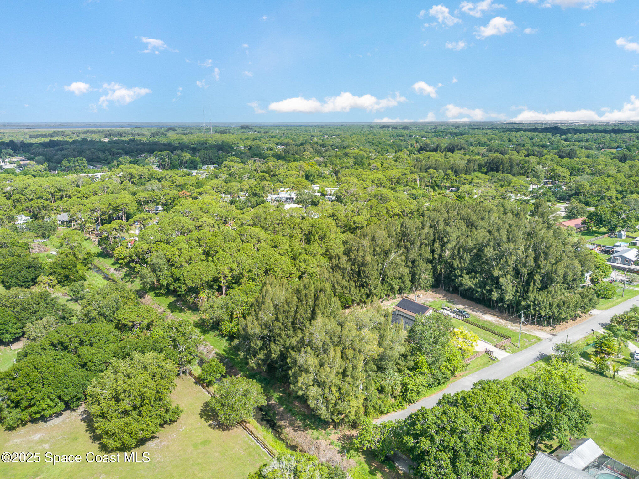 1545 Anson Road Melbourne, FL 32934 - Photo 18 of 19 a view of an outdoor space and a yard