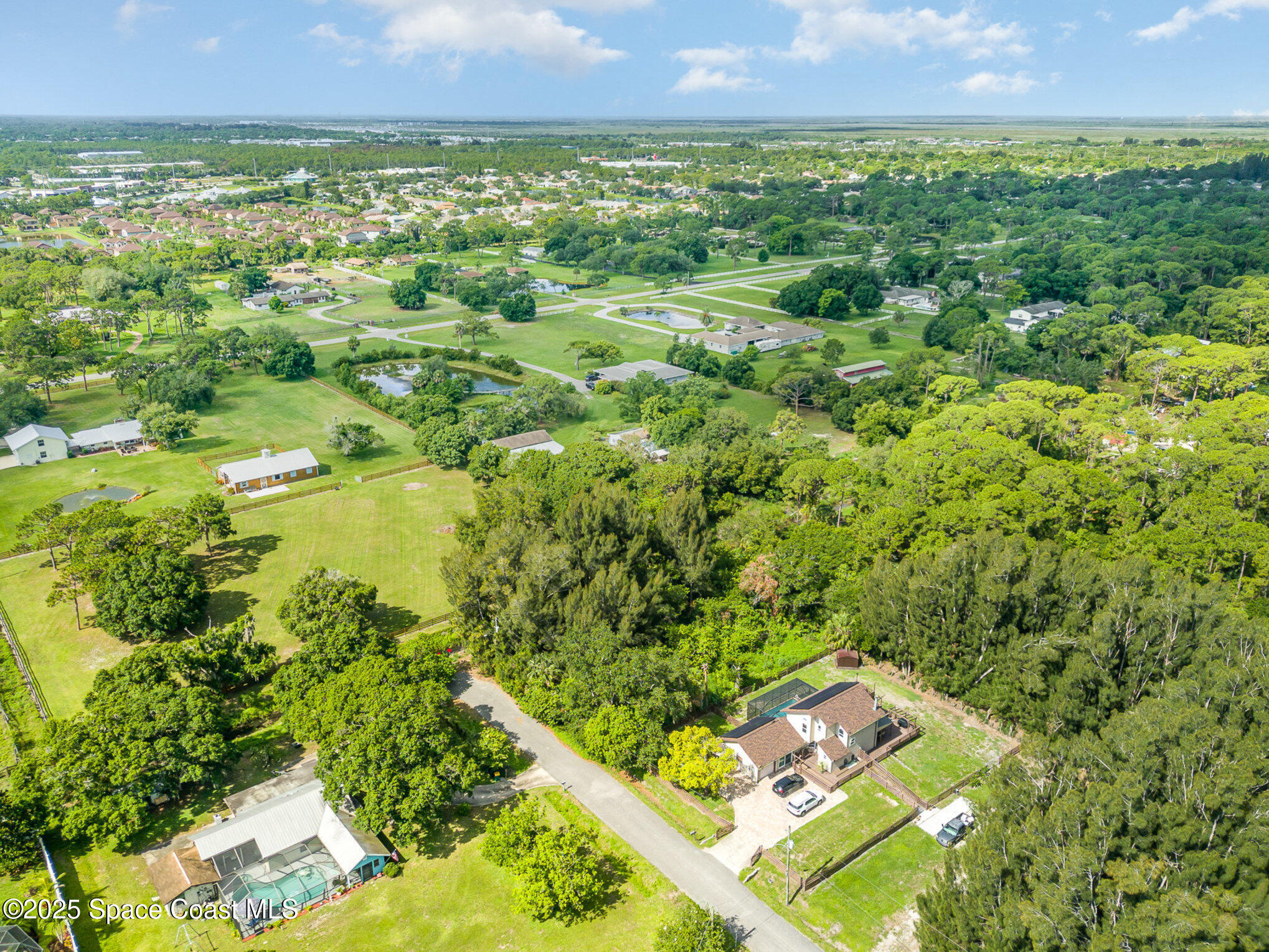 1545 Anson Road Melbourne, FL 32934 - Photo 4 of 19 a view of a lush green field