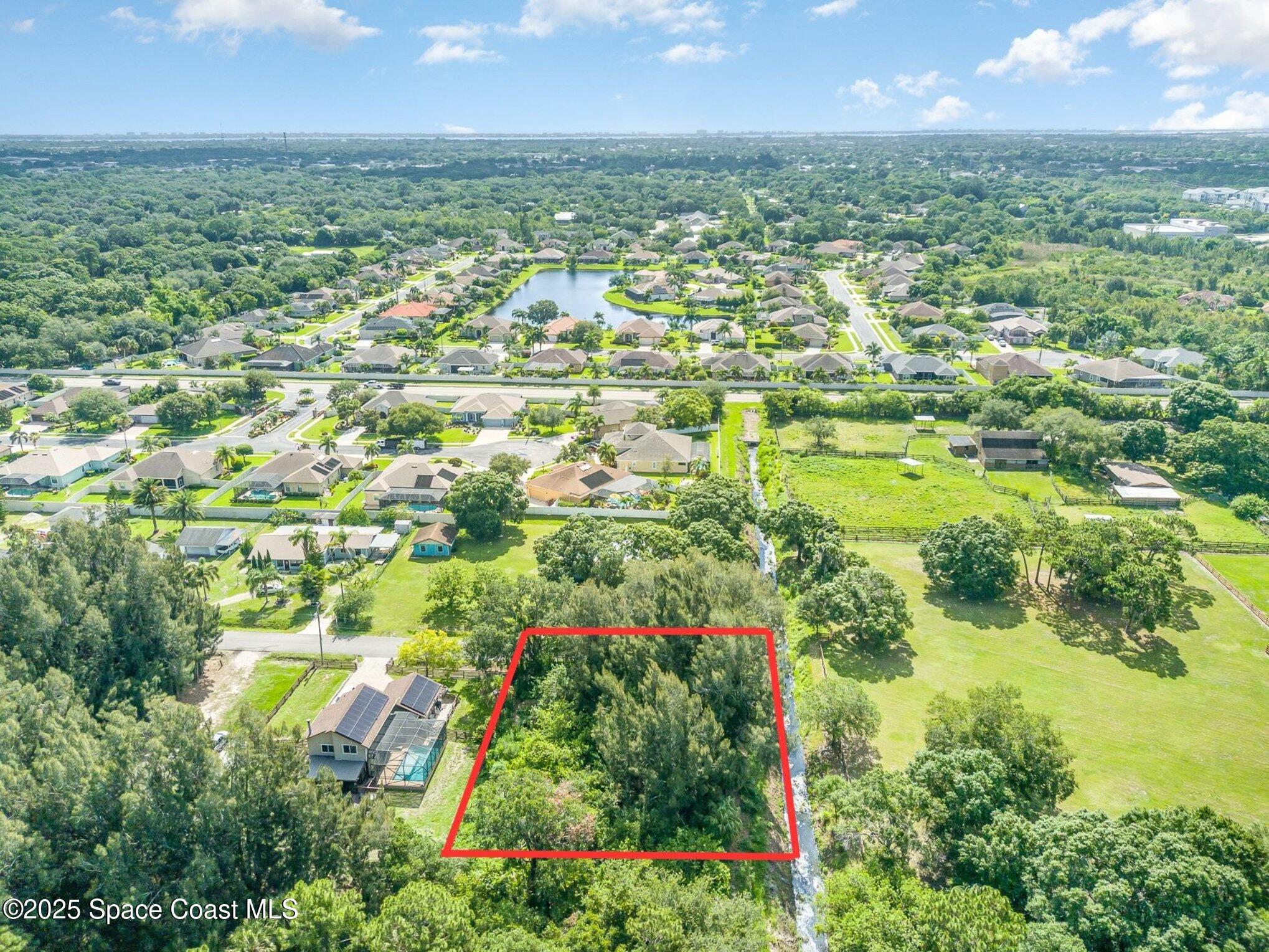 1545 Anson Road Melbourne, FL 32934 - Photo 10 of 19 a view of a city with tall buildings