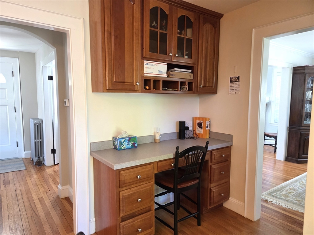 25 Waldeck Road Milton, MA 02186 - Photo 14 of 34 a view of kitchen with stainless steel appliances granite countertop a sink dishwasher stove and cabinets