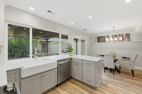 a kitchen with a sink and cabinets