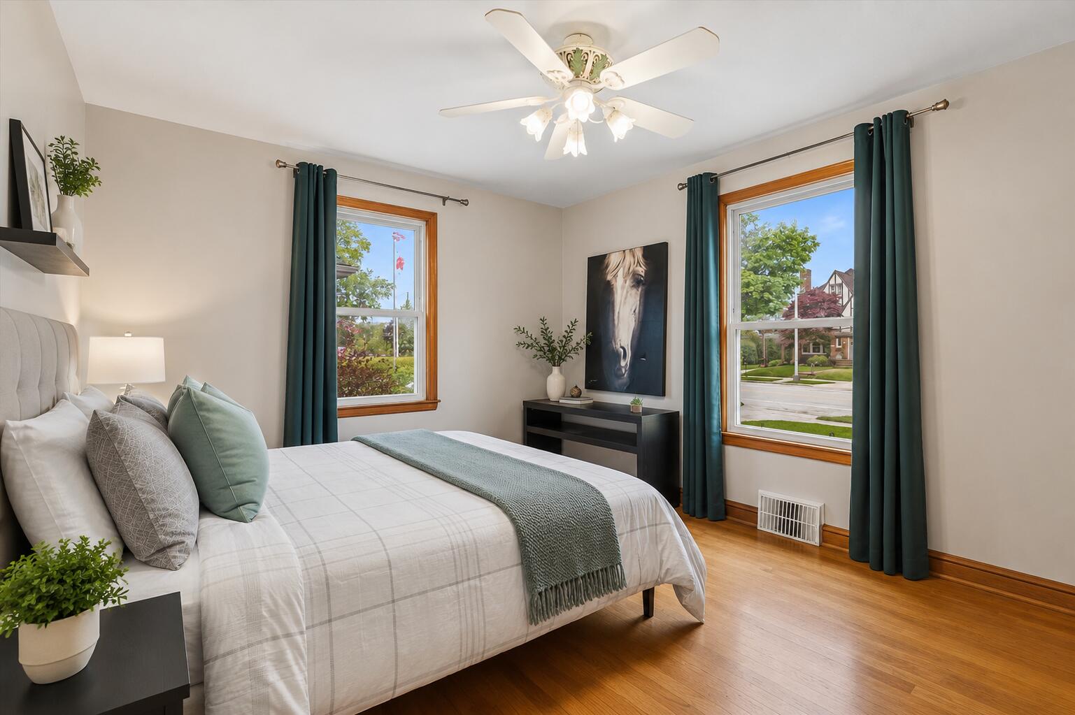 2925 North Main Street Racine, WI 53402 - Photo 12 of 23 Featuring beautiful hardwood floors and oversized windows, this versatile bedroom offers comfort, character, and abundant natural light.