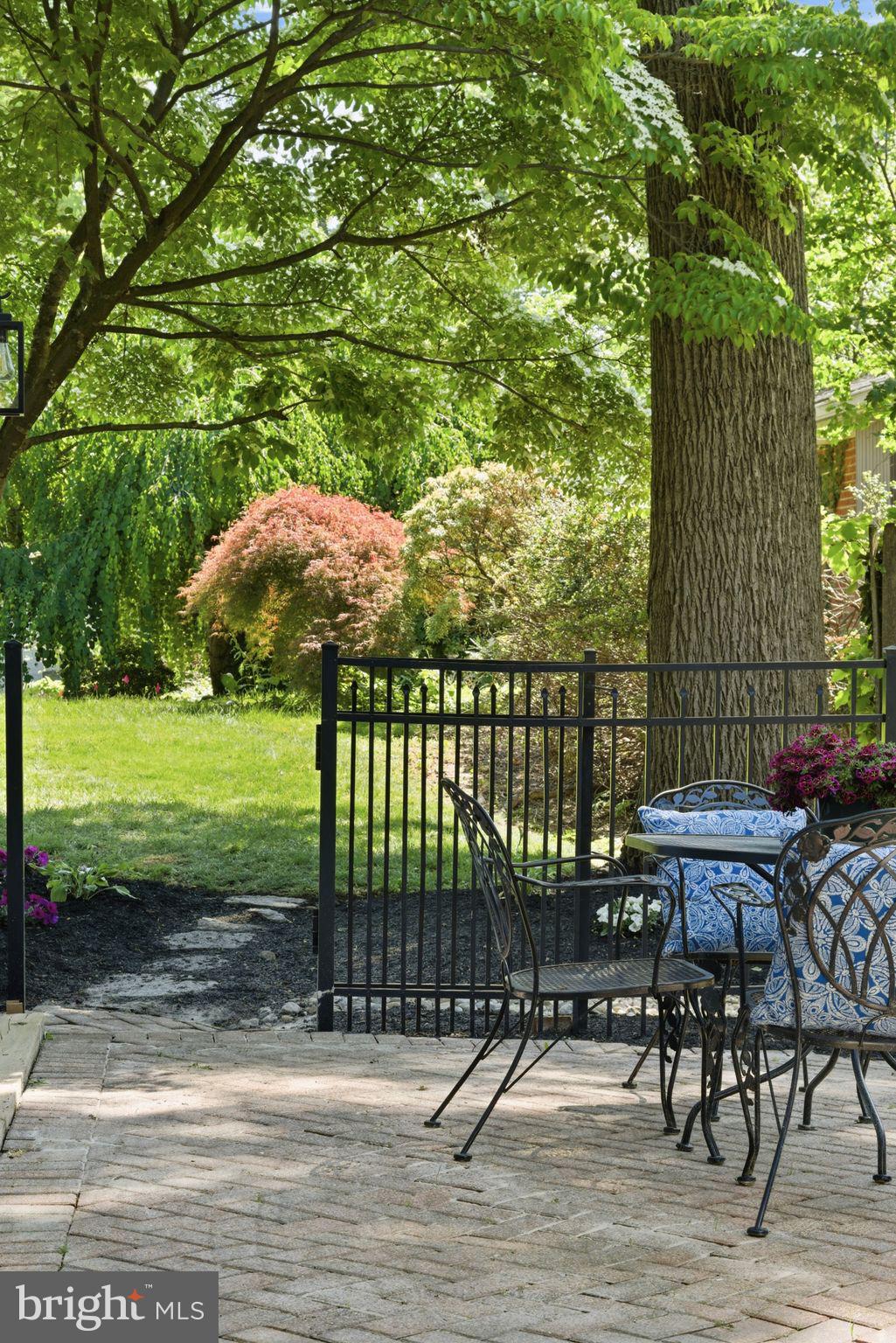 5 Brookside Circle Wayne, PA 19087 - Photo 37 of 49 a view of a patio with table and chairs with wooden floor and fence