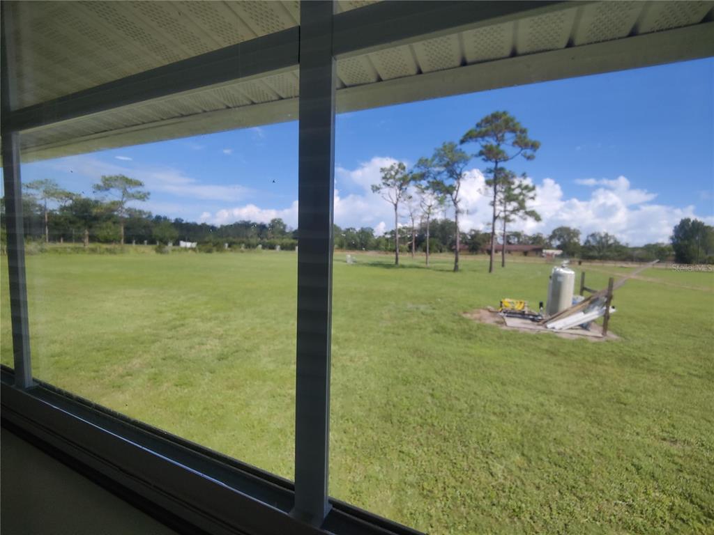 6804 Beth Road, Unit A Orlando, FL 32824 - Photo 13 of 14 a view of a room with a big yard