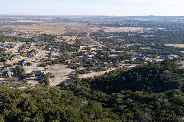 an aerial view of residential house and green space
