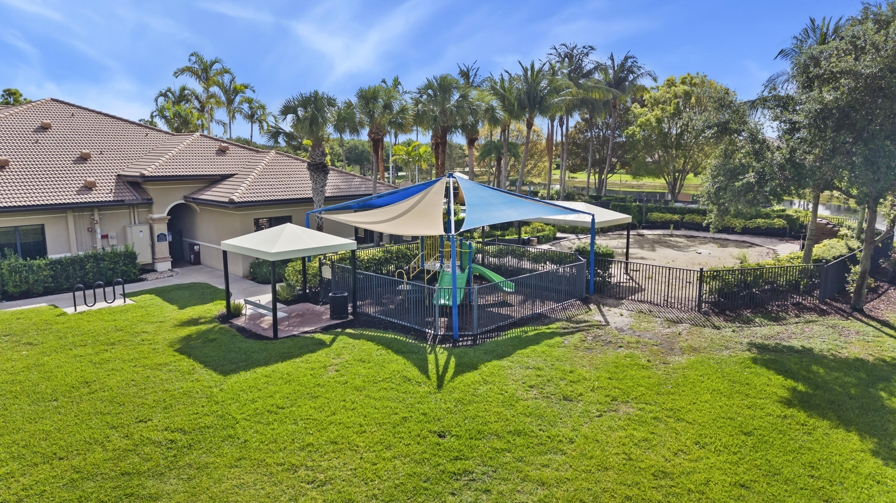 6513 Monterey Point, Unit 201 Naples, FL 34105 - Photo 31 of 35 41_the marbella lakes clubhouse - playgr