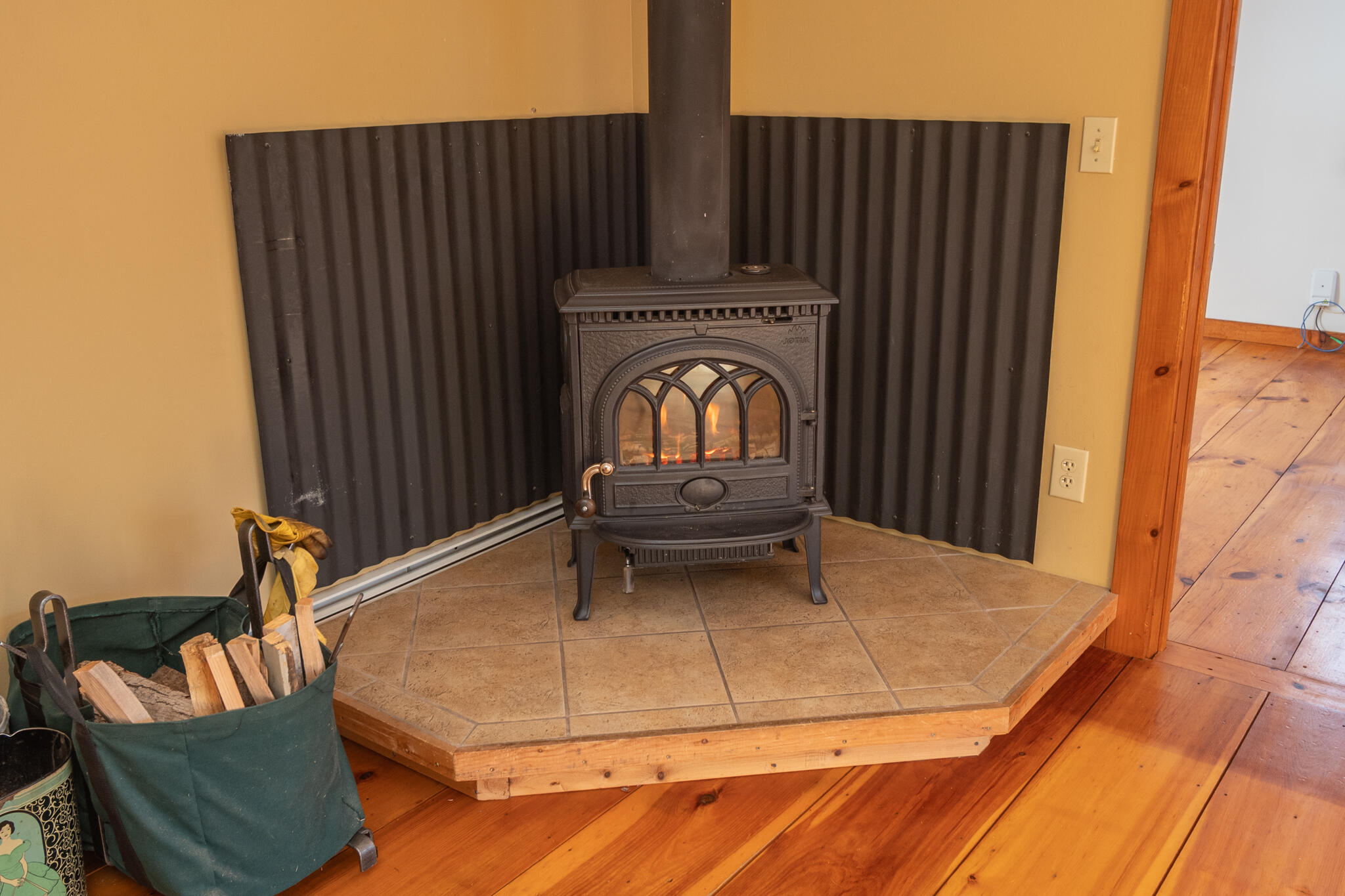 406 Industry Road Farmington, ME 04938 - Photo 27 of 59 Wood-burning stove in living room