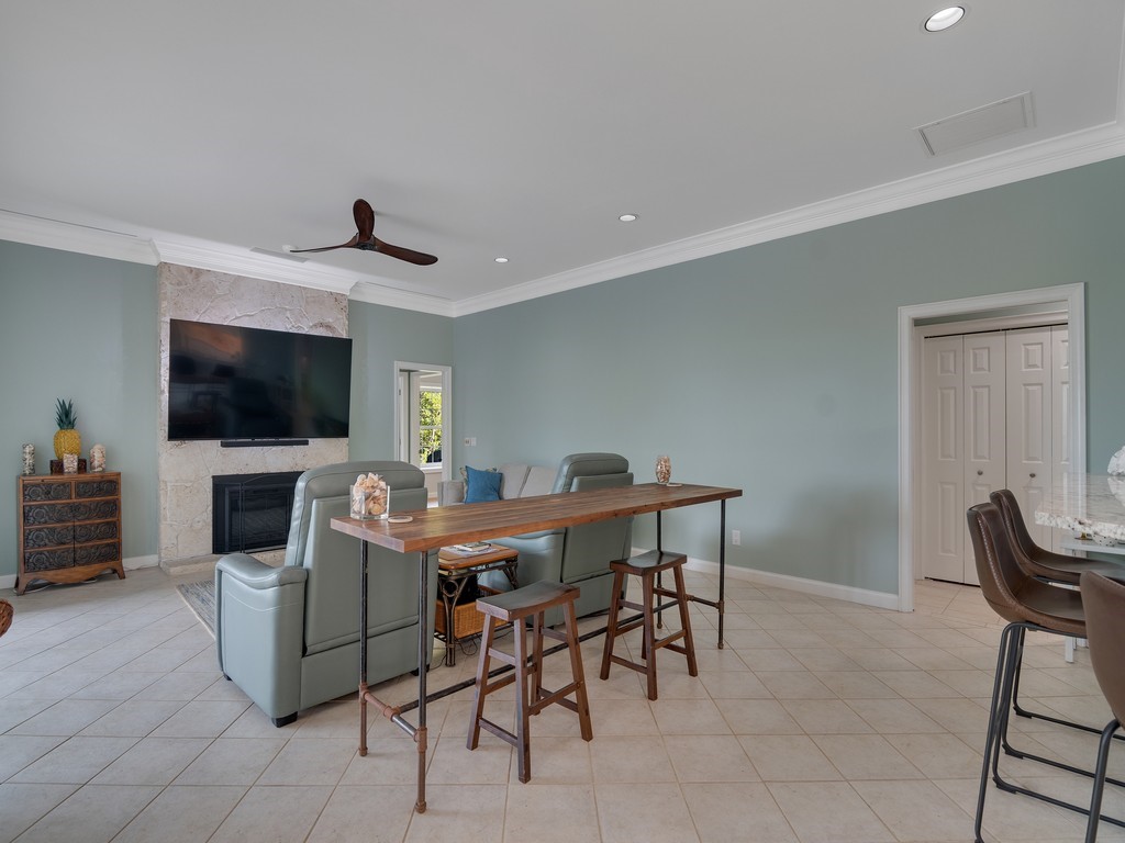 1 Cache Cay Drive Vero Beach, FL 32963 - Photo 13 of 36 a view of a livingroom with furniture and a flat screen tv