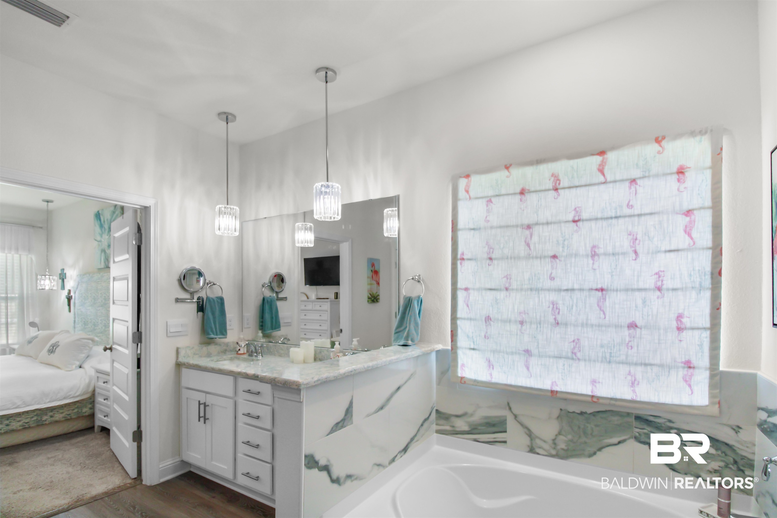 1885 Carly Street Foley, AL 36535 - Photo 18 of 40 Spacious bathroom featuring a dual vanity with a light-toned countertop, white cabinetry, and undermount sinks