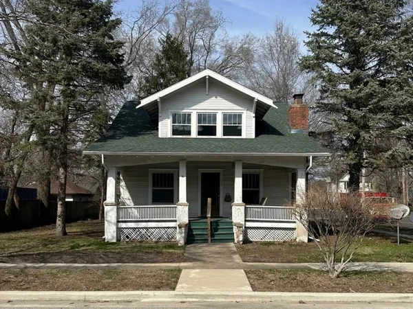 a front view of a house with garage