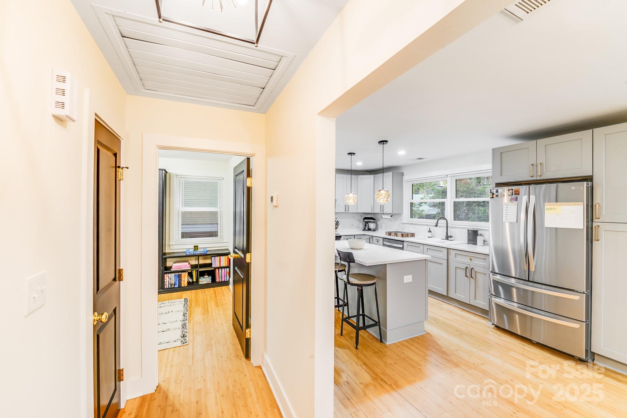 4910 Valley Stream Road Charlotte, NC 28209 - Photo 15 of 35 a kitchen with cabinets and a refrigerator