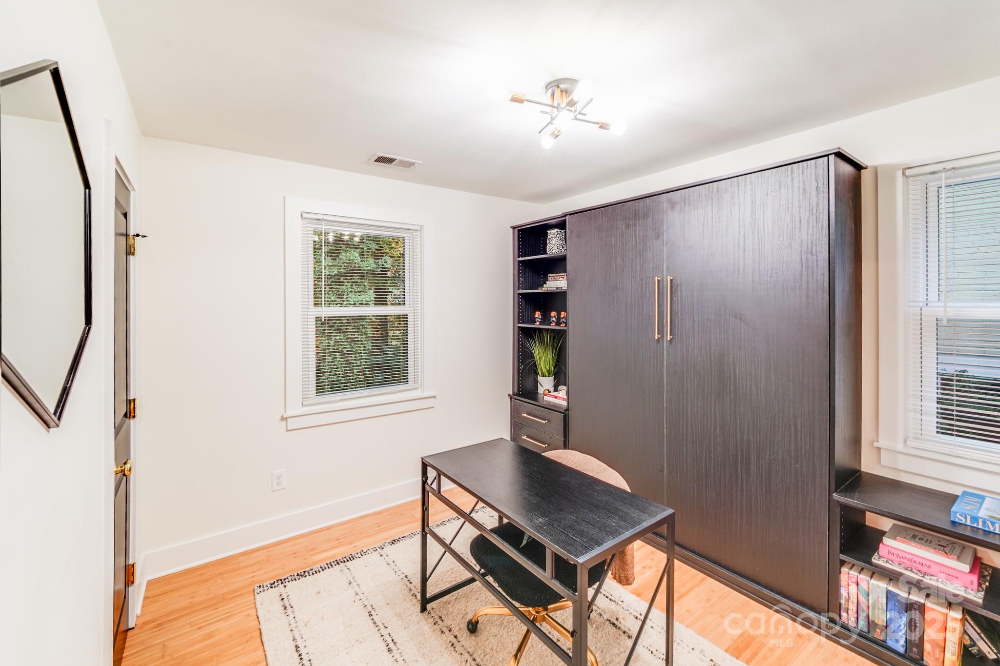 4910 Valley Stream Road Charlotte, NC 28209 - Photo 16 of 35 a living room with furniture and a window