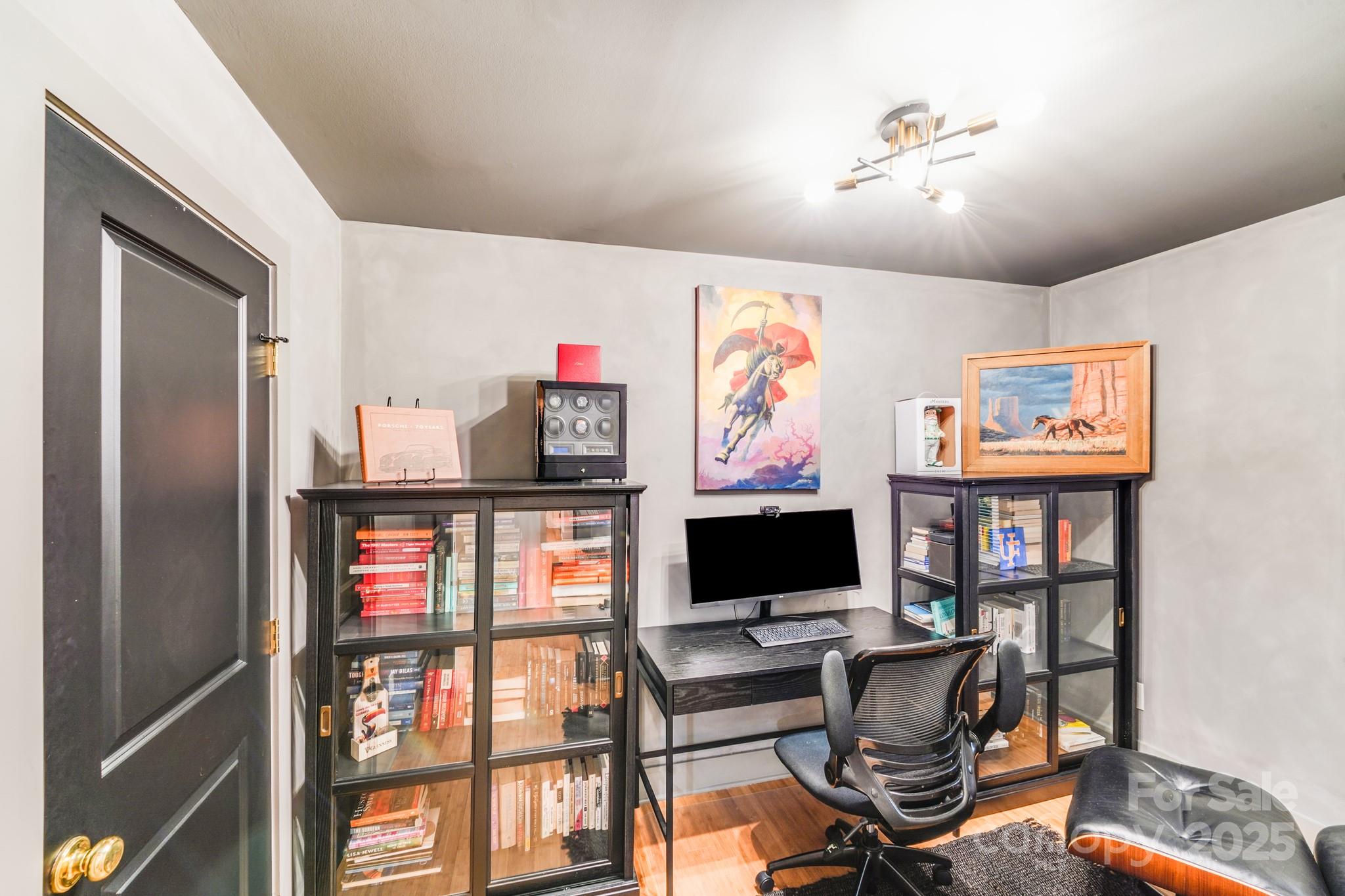 4910 Valley Stream Road Charlotte, NC 28209 - Photo 19 of 35 a view of a livingroom with workspace and a window