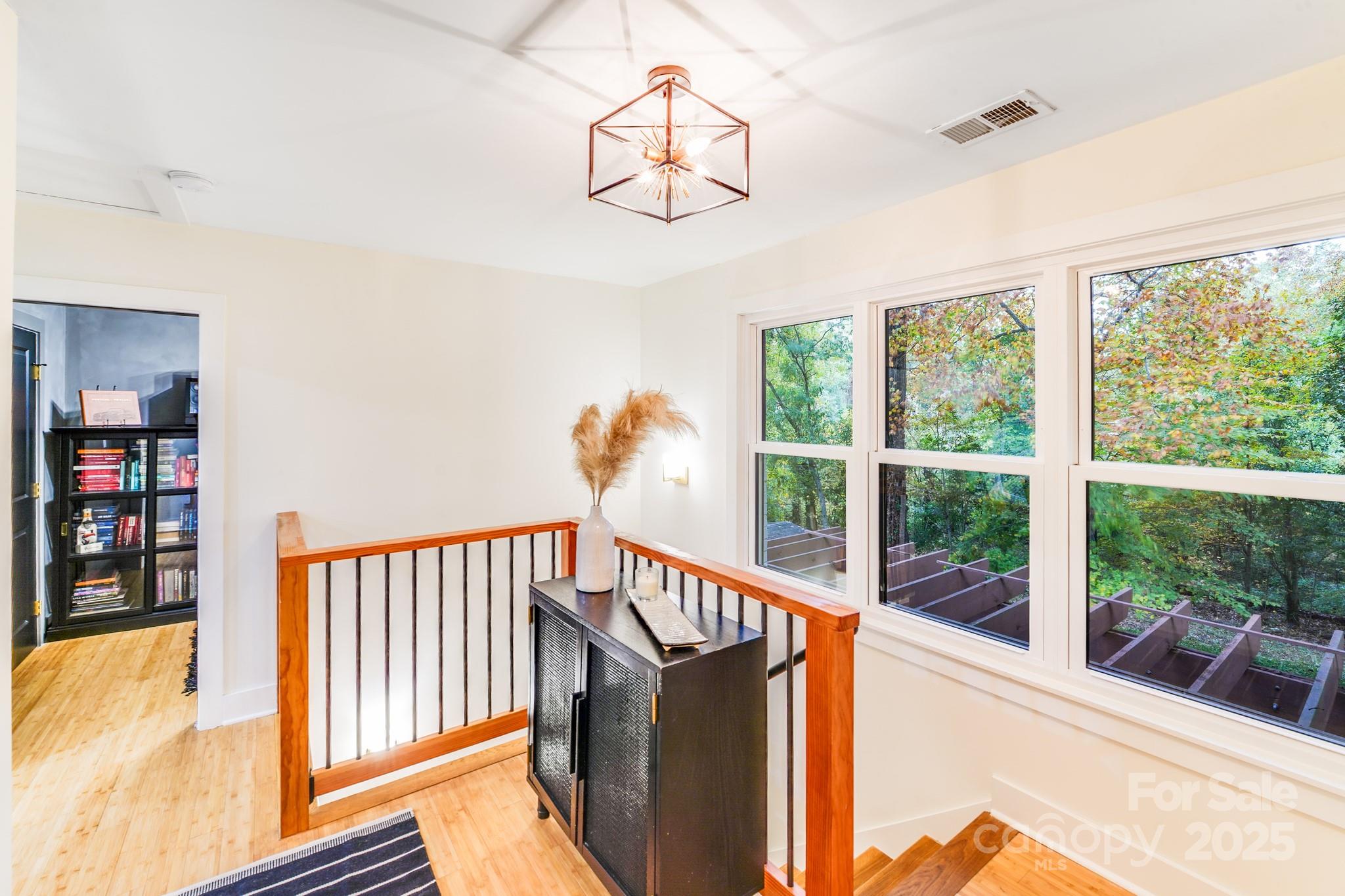 4910 Valley Stream Road Charlotte, NC 28209 - Photo 21 of 35 a view of a balcony with furniture and a large window