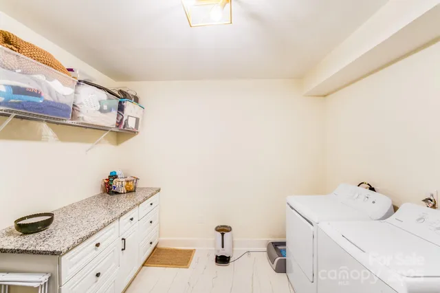 a bathroom with a sink and a shower curtain