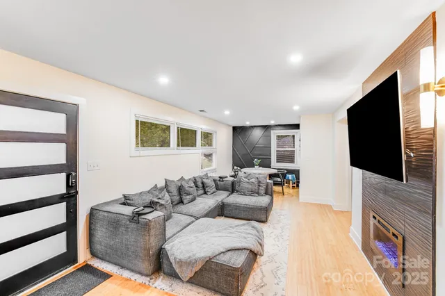 a living room with furniture and a flat screen tv