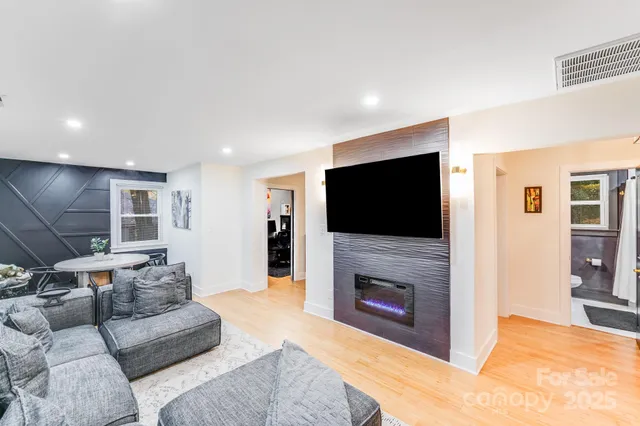 a living room with furniture and a flat screen tv