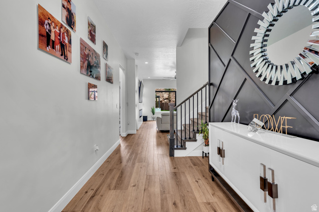 6105 Bunda Way St. George, UT 84790 - Photo 4 of 49 Hardwood-finish flooring extending through the hallway