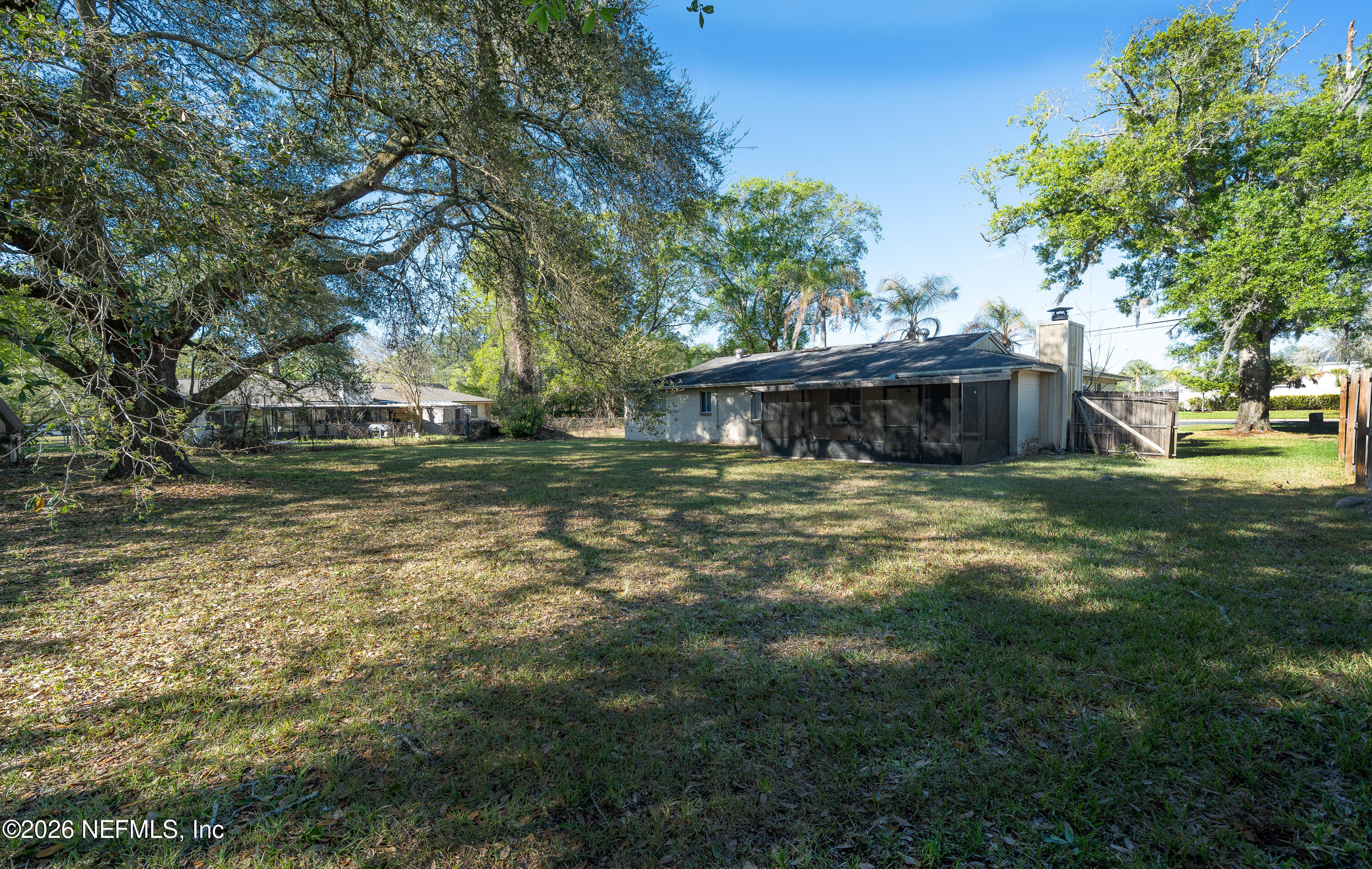 147 Knight Boxx Road Middleburg, FL 32068 - Photo 25 of 30 a view of a house with a yard