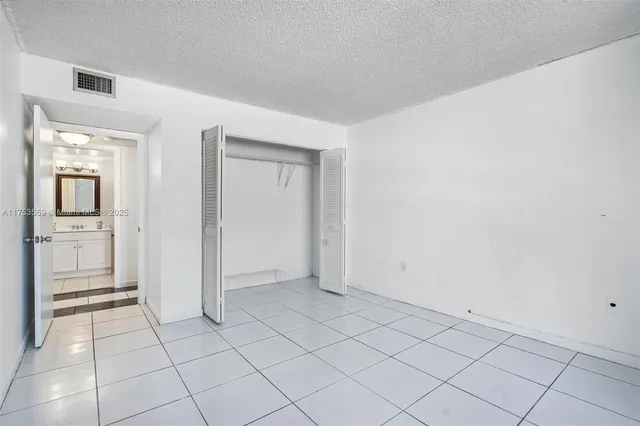 a view of an empty room and a window