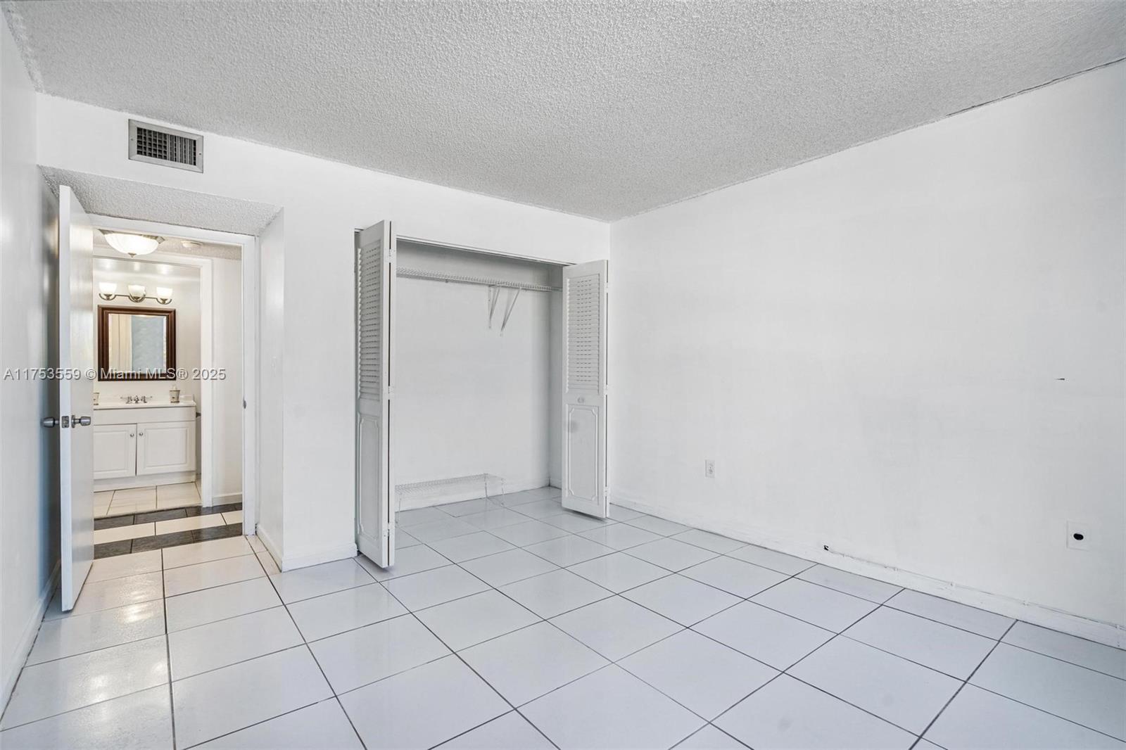 7300 Wayne Avenue, Unit 317 Miami Beach, FL 33141 - Photo 11 of 26 a view of an empty room and a window