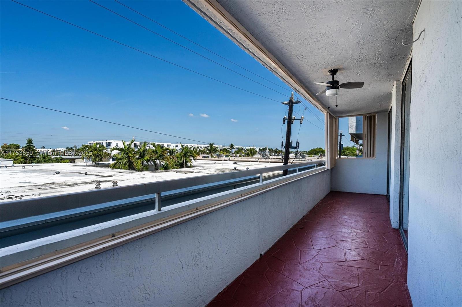 7300 Wayne Avenue, Unit 317 Miami Beach, FL 33141 - Photo 20 of 26 a view of a kitchen with kitchen island and stainless steel appliances