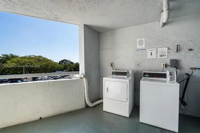 a view of a storage & utility room with washer and dryer