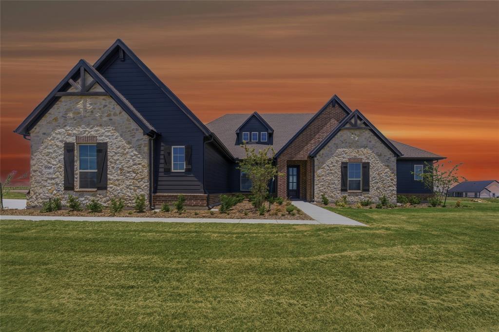 2305 Gypsum Street Krum, TX 76249 - Photo 1 of 26 Stone and dark siding exterior with prominent gables and dark window shutters