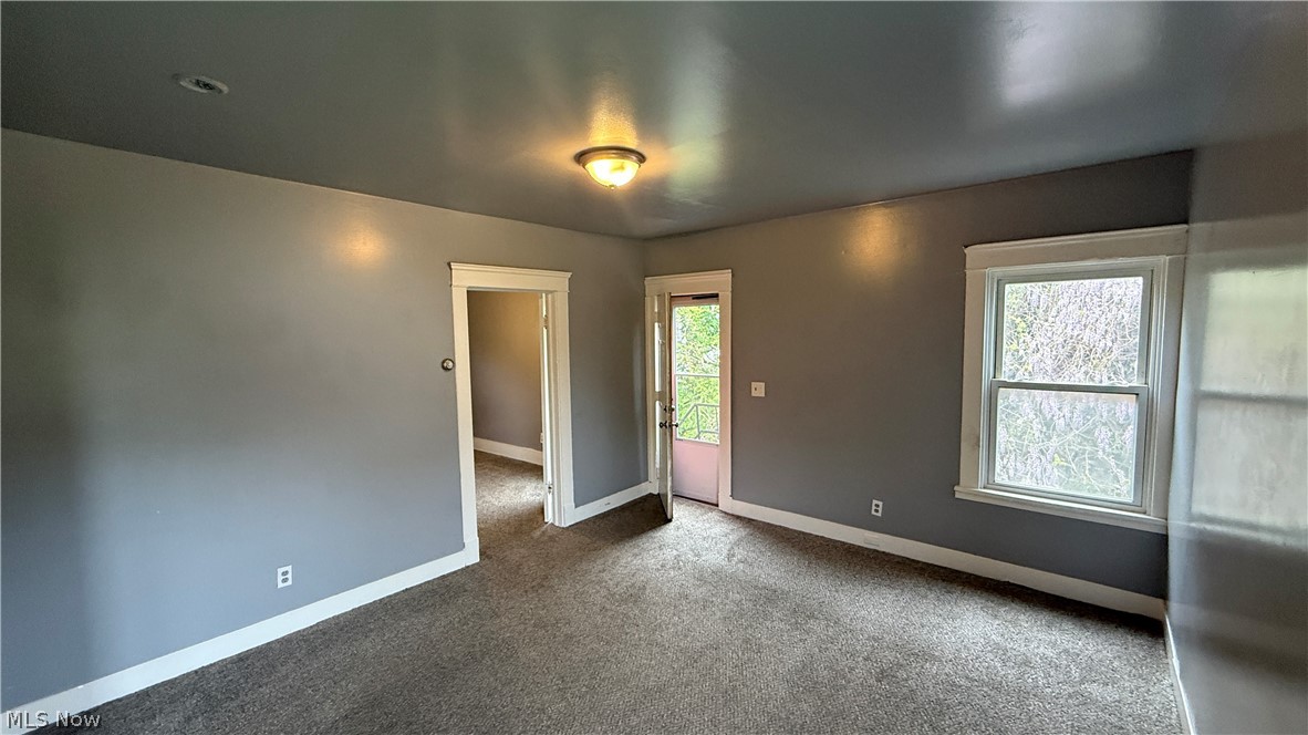1187 Addison Road, Unit 4 Cleveland, OH 44103 - Photo 13 of 15 Carpeted interior with neutral wall and ceiling finishes