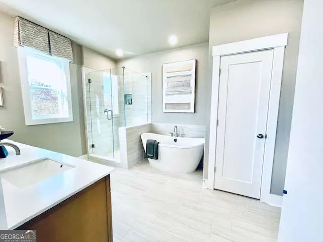 a large spacious bathroom with a double vanity sink a mirror and a bathtub
