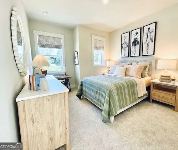 a bedroom with a bed a mirror and a window