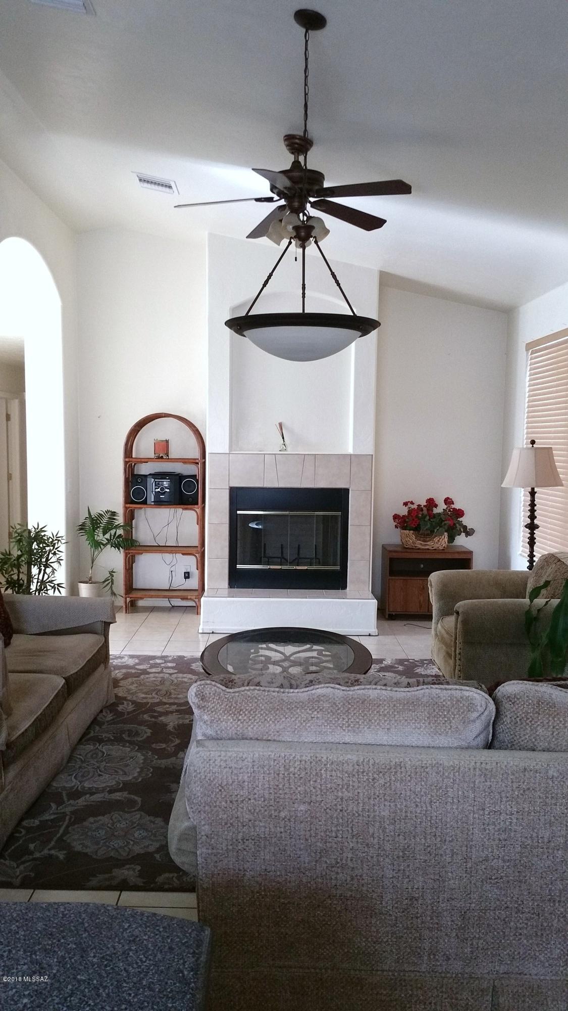 407 Willow Drive Rio Rico, AZ 85648 - Photo 5 of 15 a living room with furniture and a fireplace