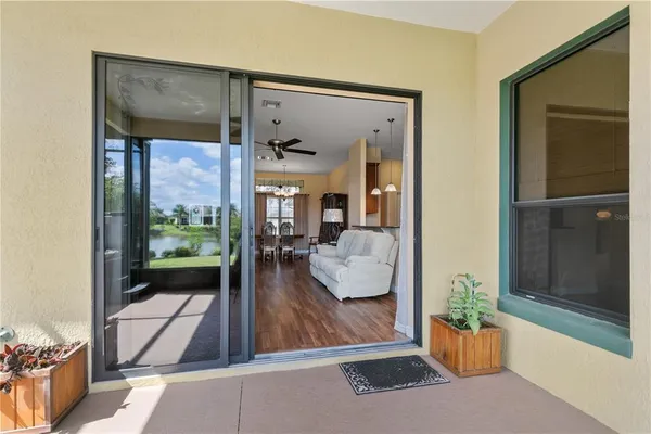 a view of a living room and a balcony