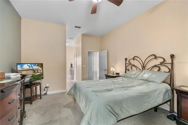 a bedroom with a bed and a desk