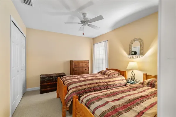 a bedroom with a bed and a closet