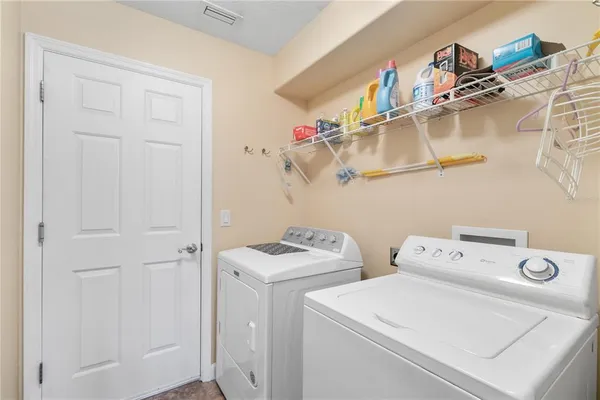 a utility room with dryer and washer