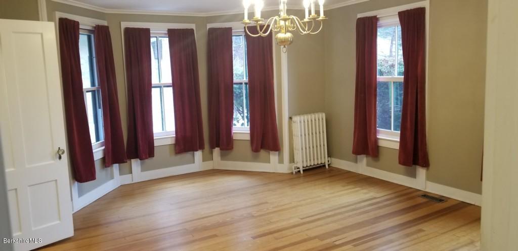 830 E Road Clarksburg, MA 01247 - Photo 8 of 30 a view of a room with wooden floor and stairs