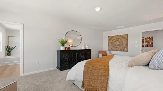 a living room with furniture and a painting