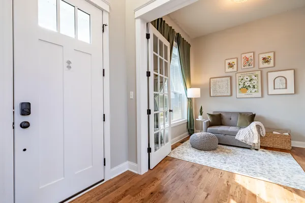 a view of a dining room with furniture window and wooden floor