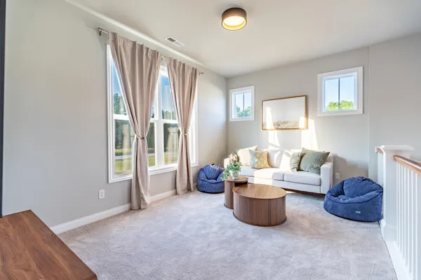 a bathroom with a sink a light fixture and a mirror