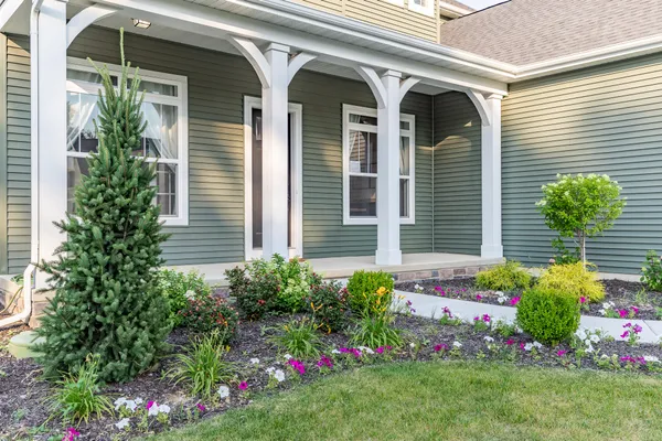 a front view of a house with a yard